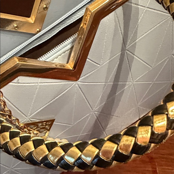 Elegant White Handbag with Gold Accents - Picture 14 of 17